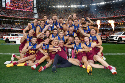 The Brisbane Lions celebrate winning the premiership at the AFL grand final on Saturday.